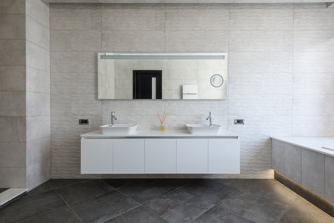 contact-img Elegant bathroom with minimalist design and modern fixtures.